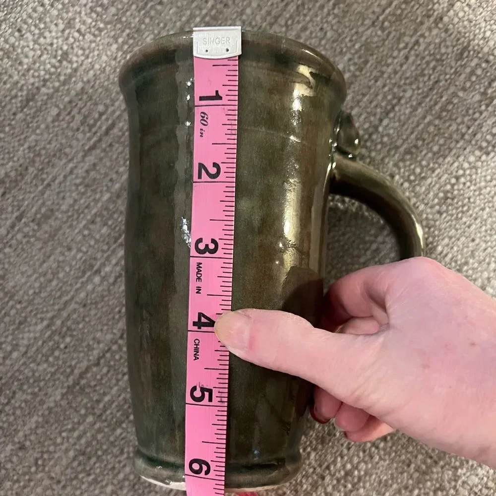Gorgeous, vintage handmade green ceramic mug with two stars
